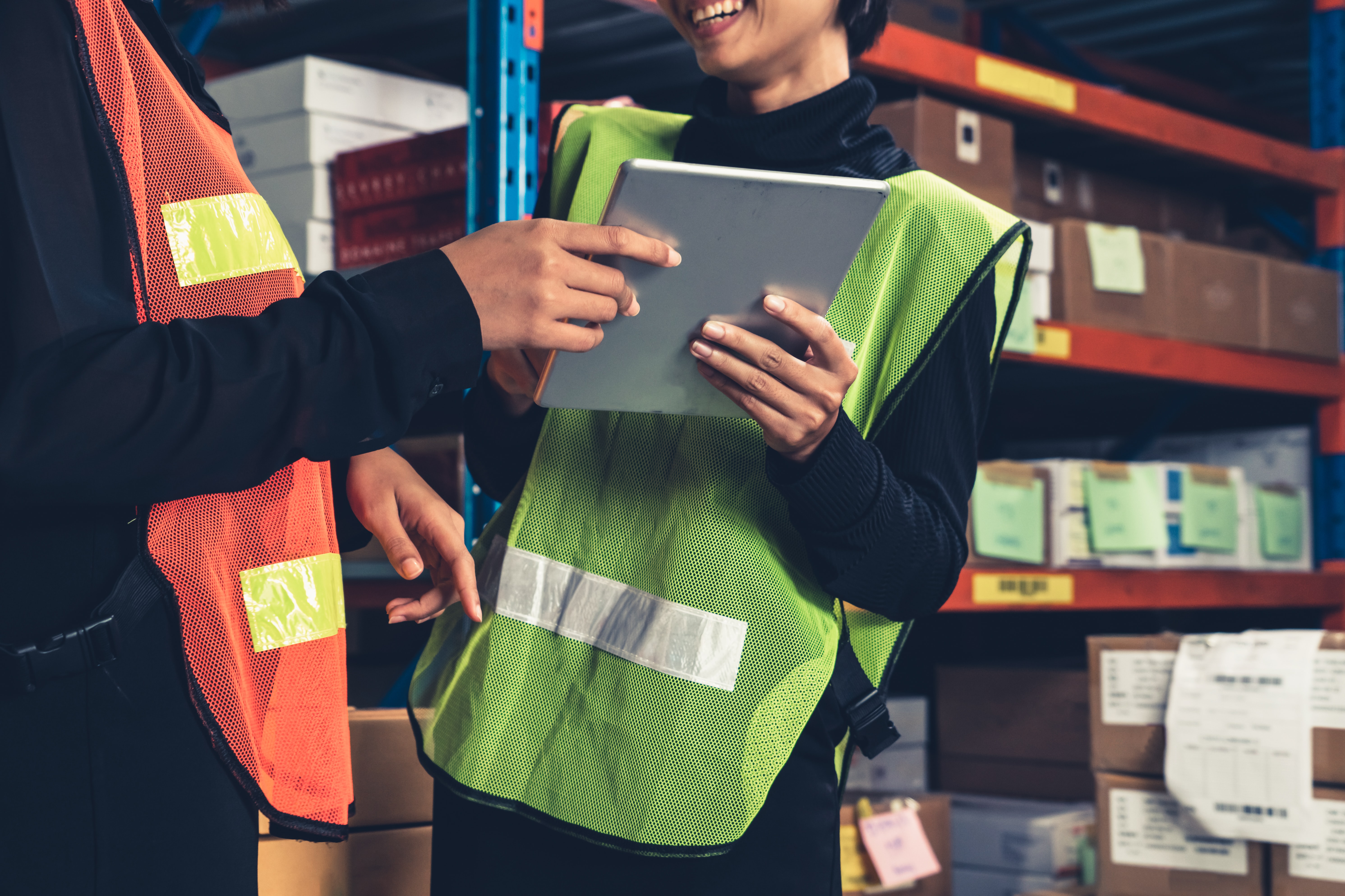 staff sharing a tablet